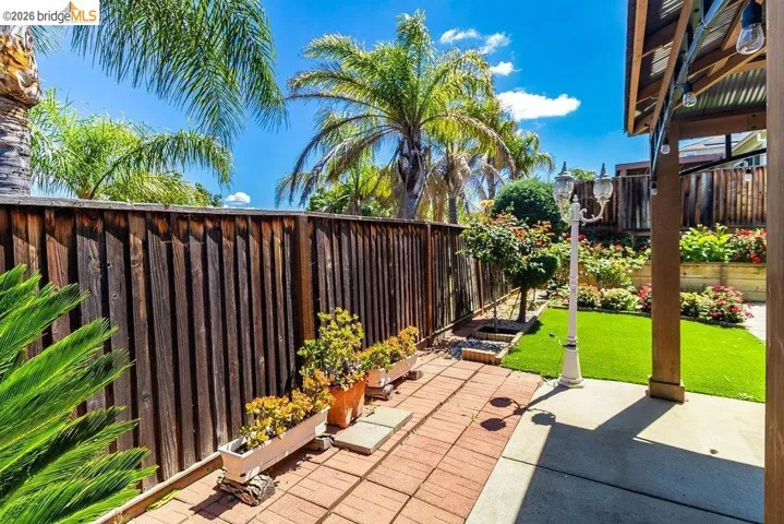 Fenced backyard with a patio area
