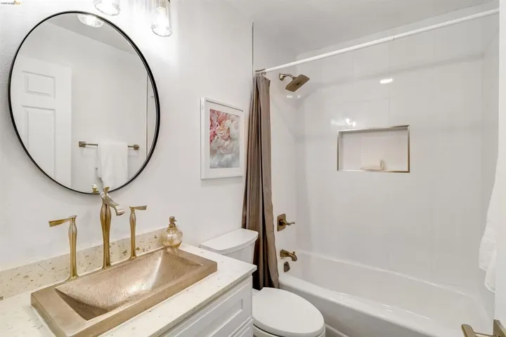 Full bathroom featuring vanity and shower / tub combo with curtain