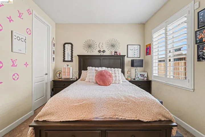 Carpeted bedroom with baseboards