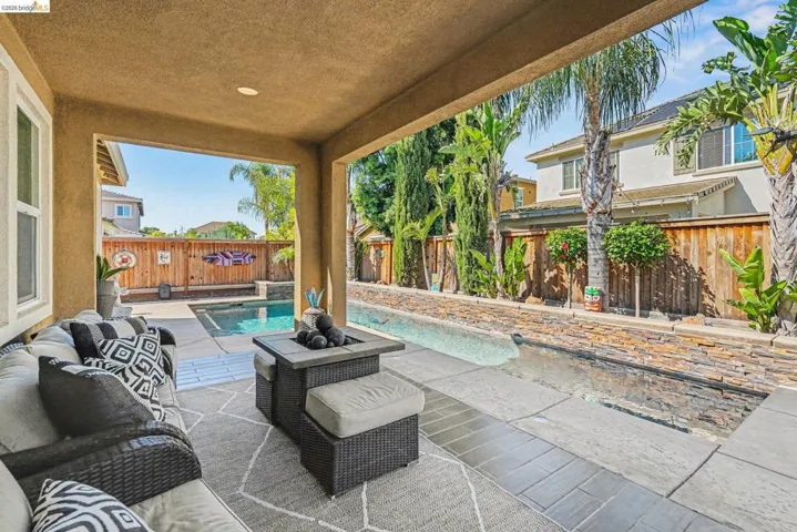 Fenced backyard featuring a patio area