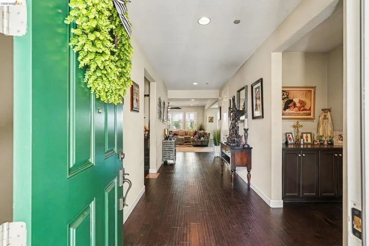 Entryway featuring recessed lighting and dark wood-style flooring