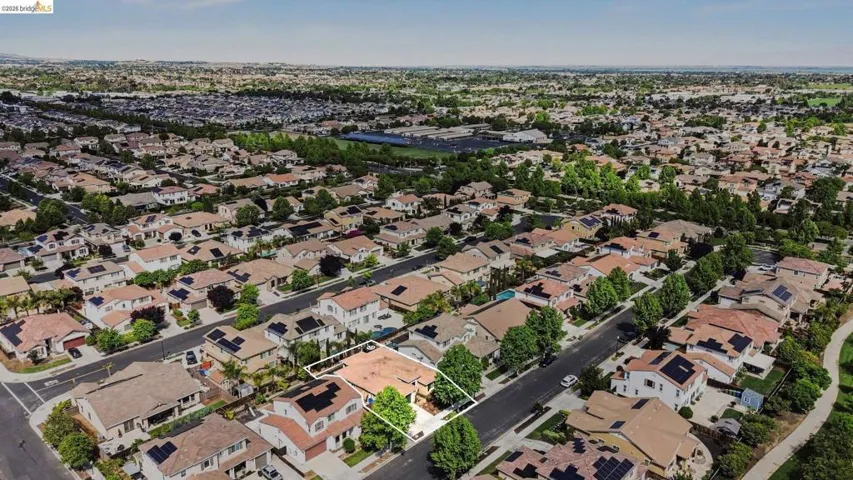 Aerial perspective of suburban area featuring property parcel outlined