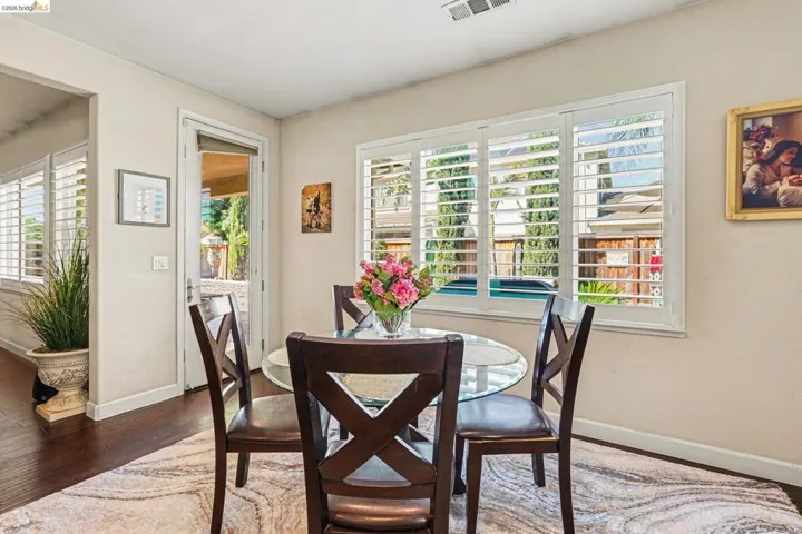 Dining area with wood finished floors and baseboards