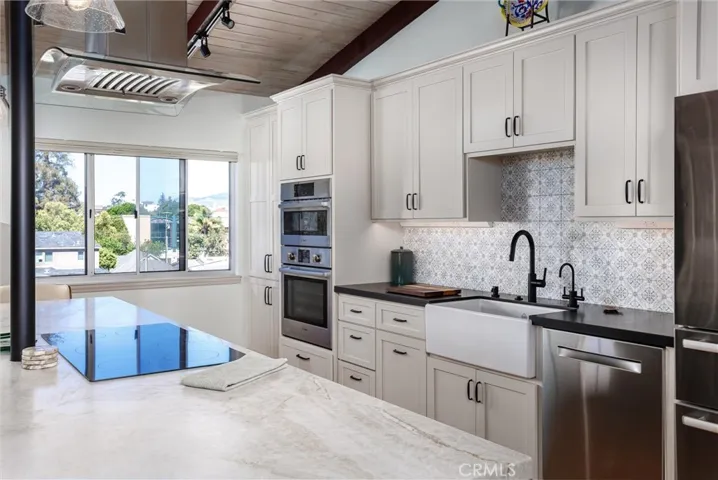 Bosch built-in oven, microwave and dishwasher, plus counter-depth fridge.