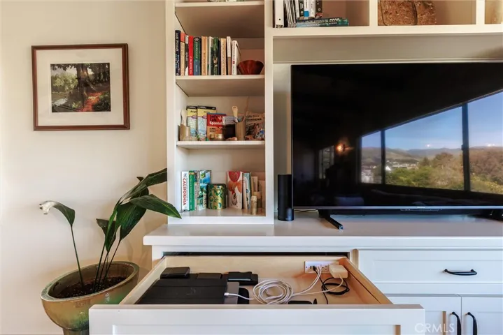 Even a charging drawer, to keep computers and devices and their endless cords stored while charging