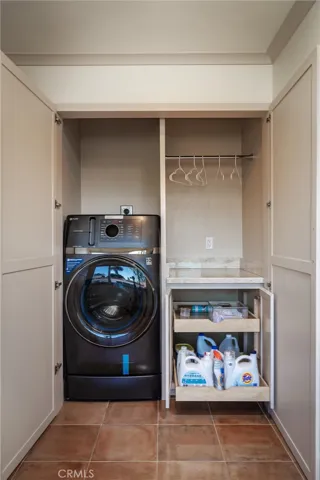 Pull-out shelving for laundry supplies
