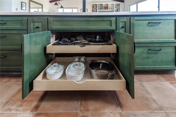 Custom cabinetry With pull-out shelves for pots and pans
