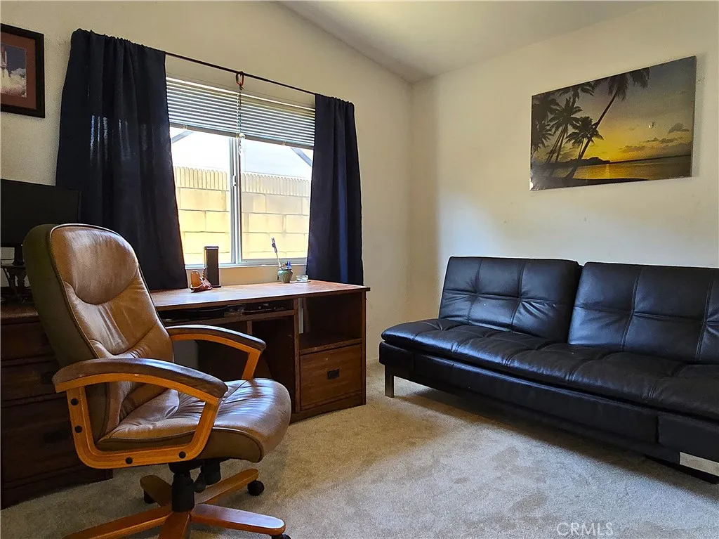 Generously sized third bedroom with warm western light—ideal as a guest room, home office, or flex space.