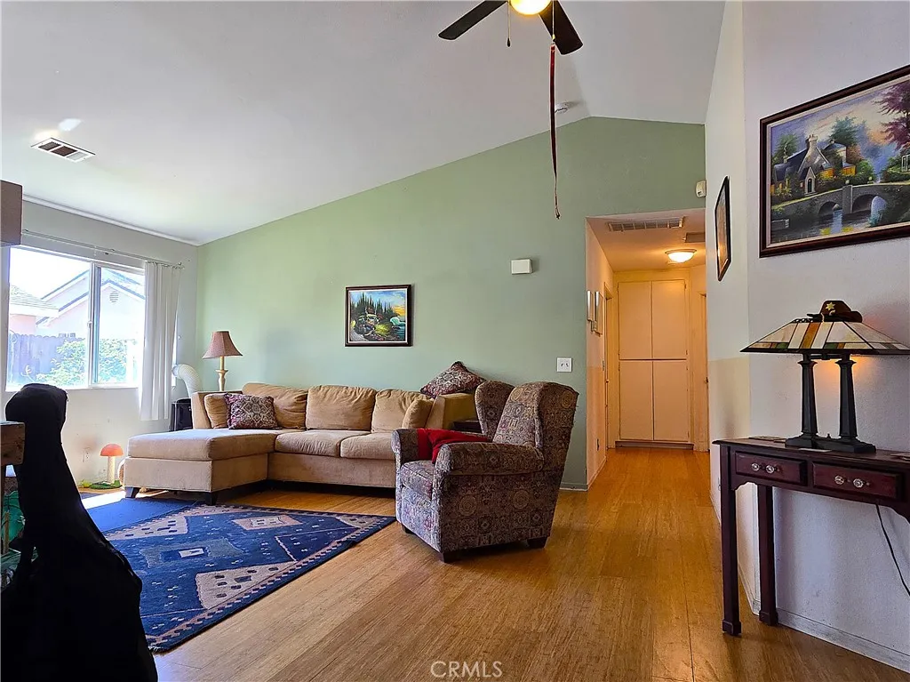 A comfortable, light-filled living area with vaulted ceilings—perfect for relaxing, entertaining, and enjoying the ease of single level living.
