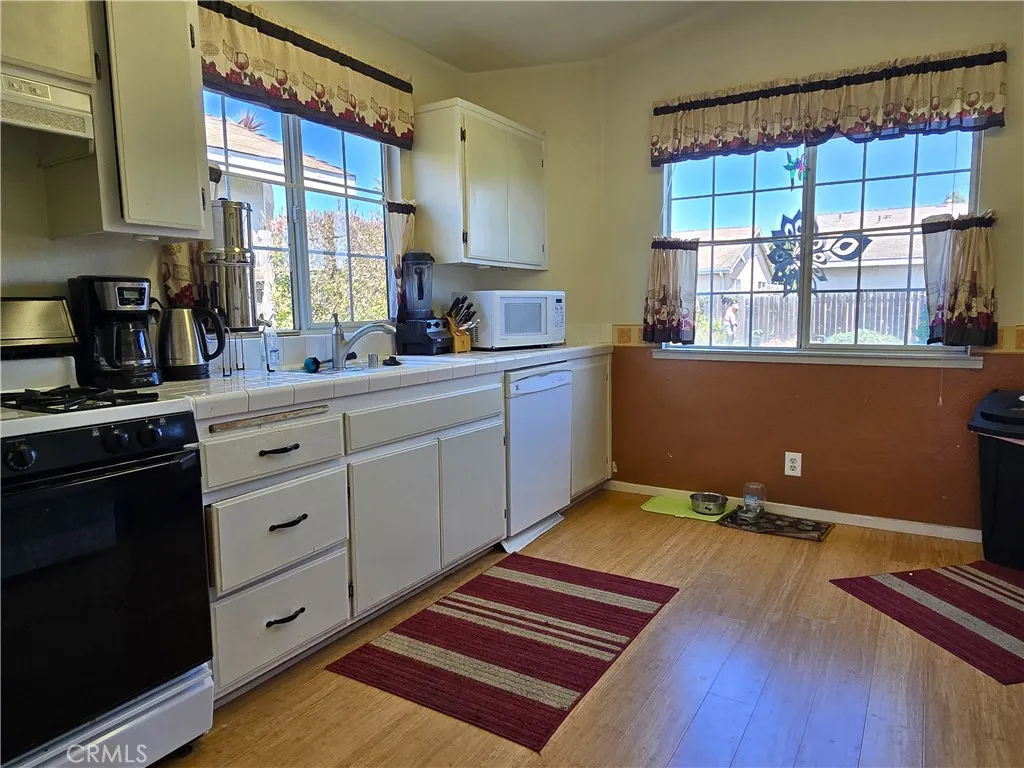 Wake up to warm natural light pouring into a kitchen designed for slow mornings and easy routines.