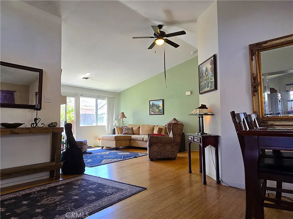 Vaulted ceilings and abundant natural light create an airy, inviting living room—one of the most sought-after features for buyers prioritizing comfort and long-term livability.