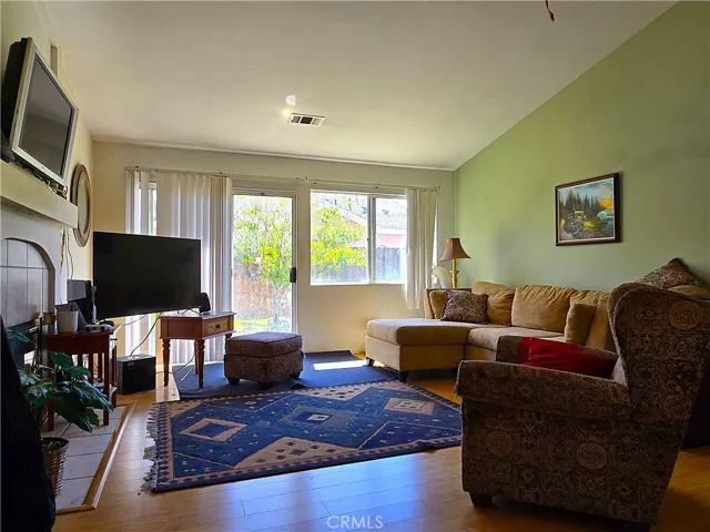A bright, inviting living room with generous natural light, ideal for both quiet evenings and gatherings with family and friends.