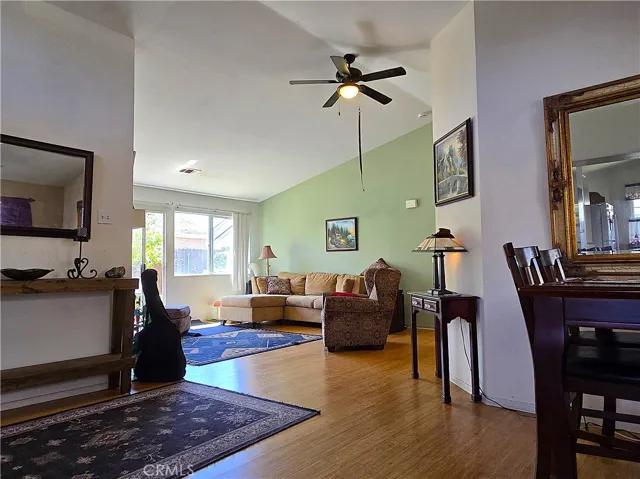 Vaulted ceilings and abundant natural light create an airy, inviting living room—one of the most sought-after features for buyers prioritizing comfort and long-term livability.