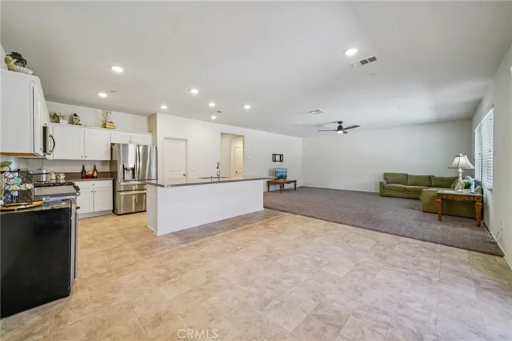 Dining area leads to kitchen and living room