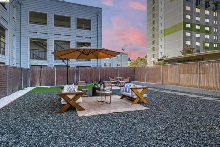 Patio terrace at dusk with a fenced backyard and a patio