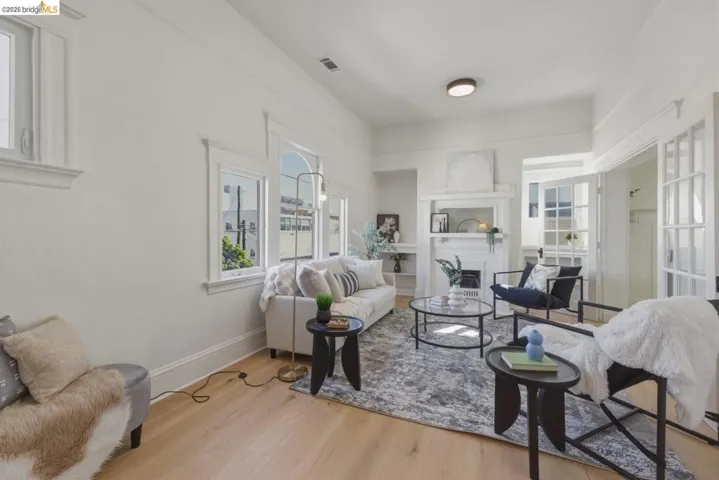 Living room featuring a fireplace and light wood-style flooring
