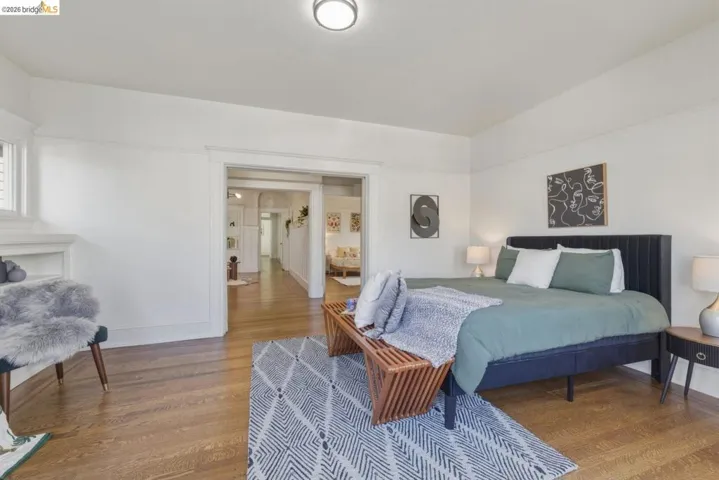 Bedroom featuring wood finished floors and baseboards