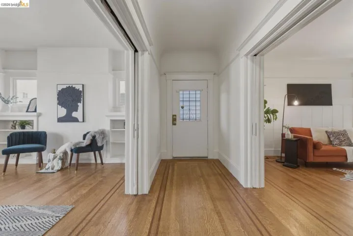 Foyer entrance featuring light wood-type flooring and baseboards