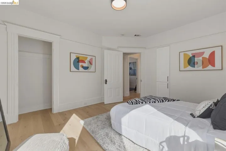 Bedroom featuring light wood finished floors and baseboards