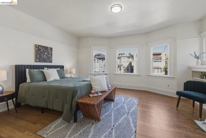 Bedroom with baseboards and dark wood finished floors