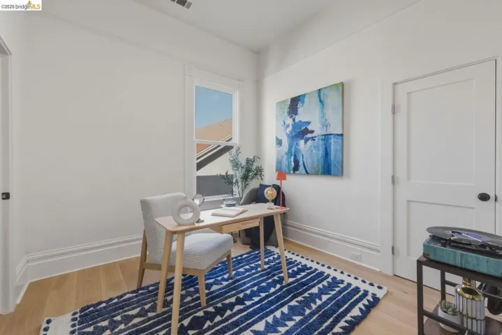 Office featuring light wood-type flooring and baseboards