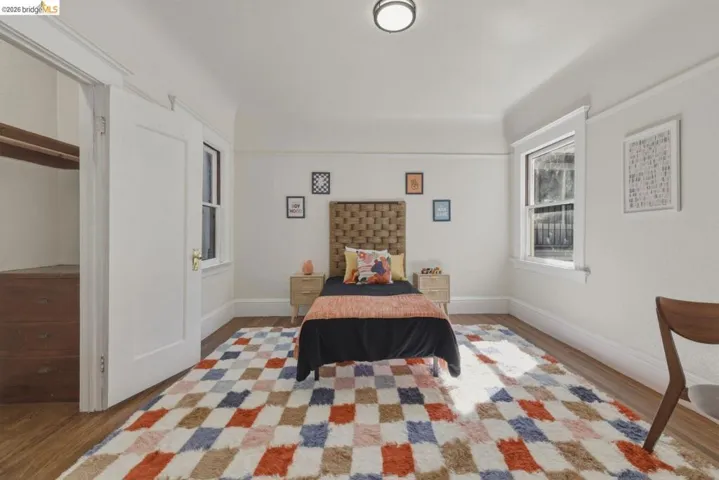 Bedroom featuring baseboards and light wood-type flooring