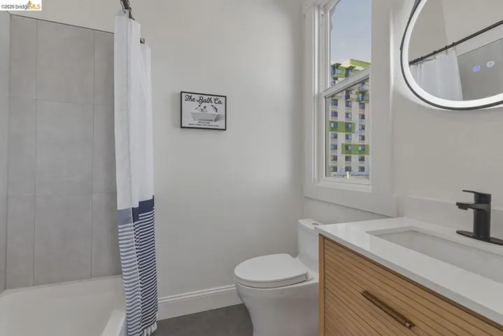 Full bathroom with vanity and shower / bath combo with shower curtain