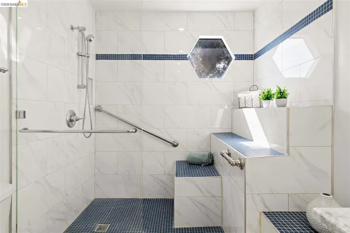 Full bathroom featuring a stall shower