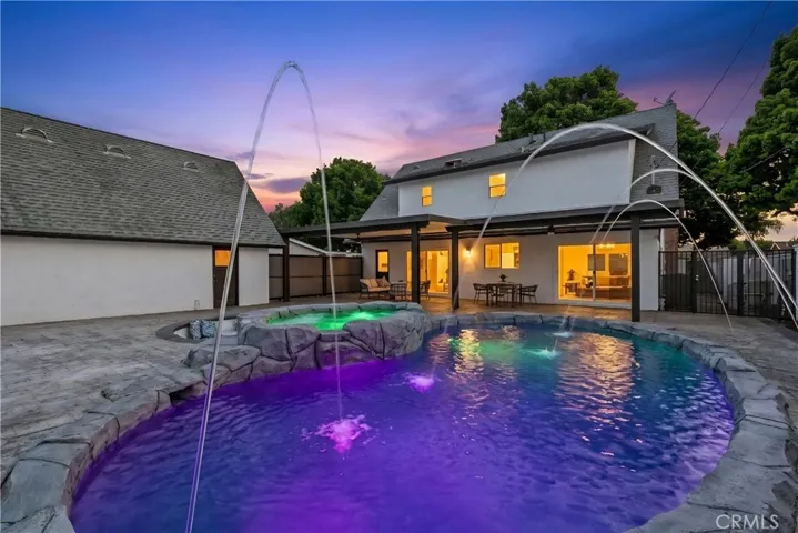 Gorgeous backyard. The pool and fountain display a dynamic color-changing lights.
(Twilight photo effect edit)