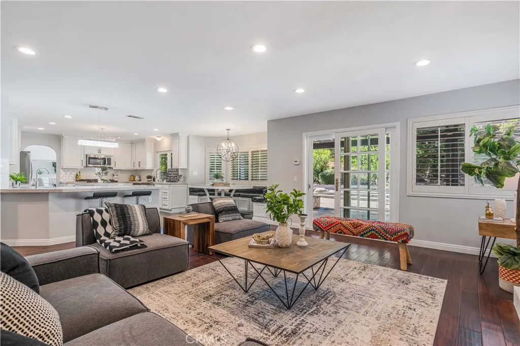 family room with direct access to backyard adjacent to kitchen