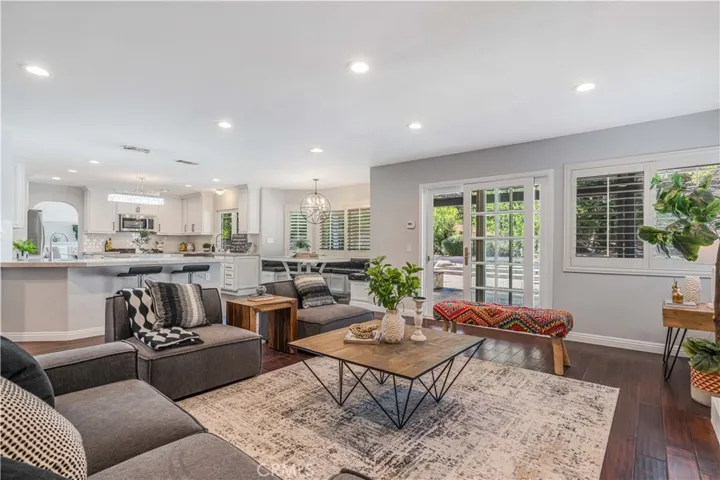 family room with direct access to backyard adjacent to kitchen