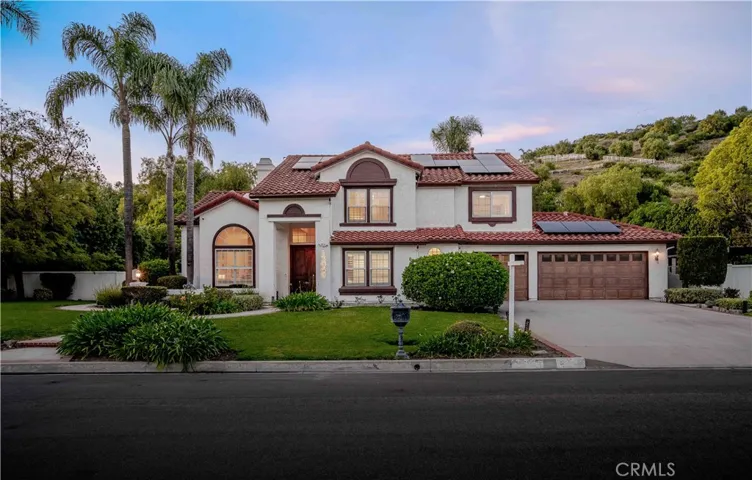 wow view of the house at twilight
