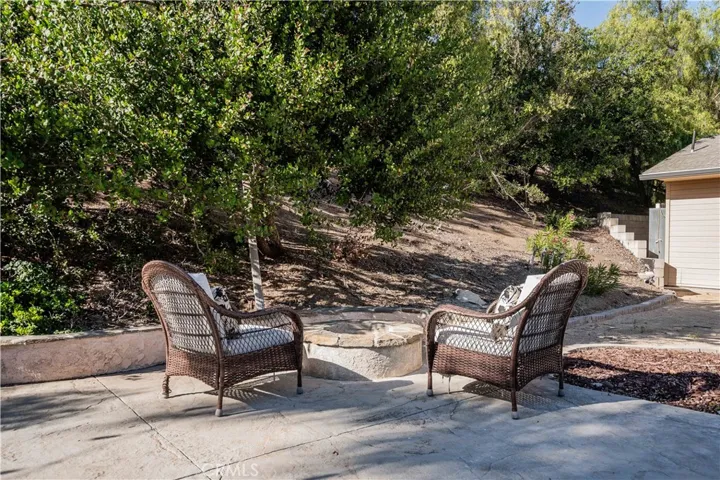 enjoy sitting by the firepit on chilly evenings sipping glass of wine with friends