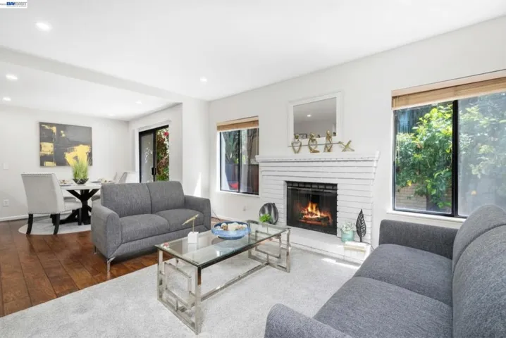 Bright living room with fireplace and large windows