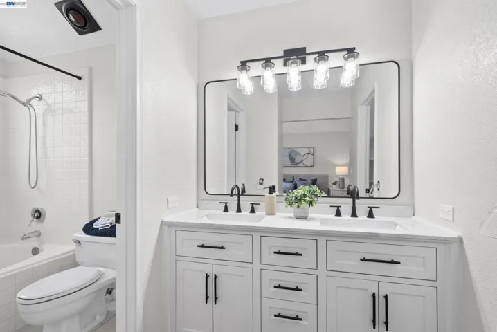 Bathroom with dual vanity and updated finishes