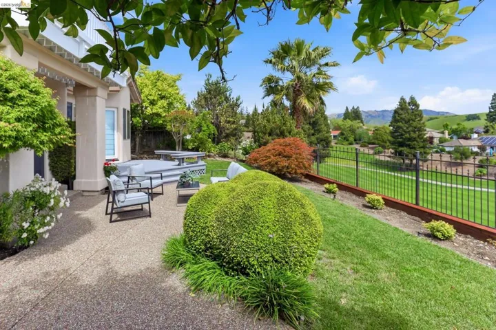 Fenced backyard with a patio area