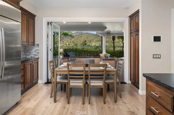 Kitchen nook has Views too. Stainless steel refrigerator is included