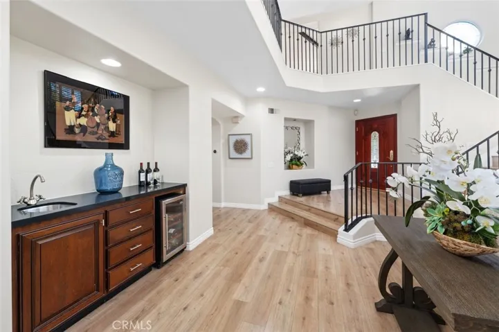 Beautiful wrought-iron staircase, & wine refrigerator is included