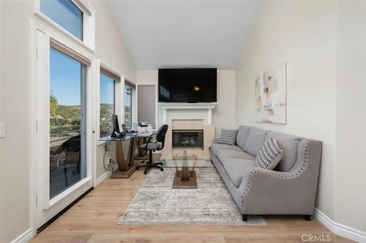 Primary bedroom with romantic fireplace to enjoy on cool nights