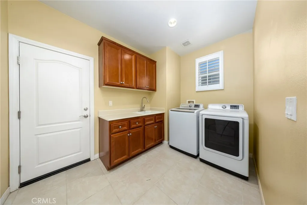 Laundry room is located behind the kitchen.