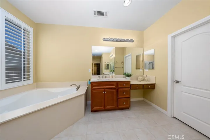 separate vanities in the mast bedroom