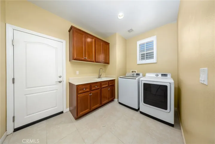 Laundry room is located behind the kitchen.