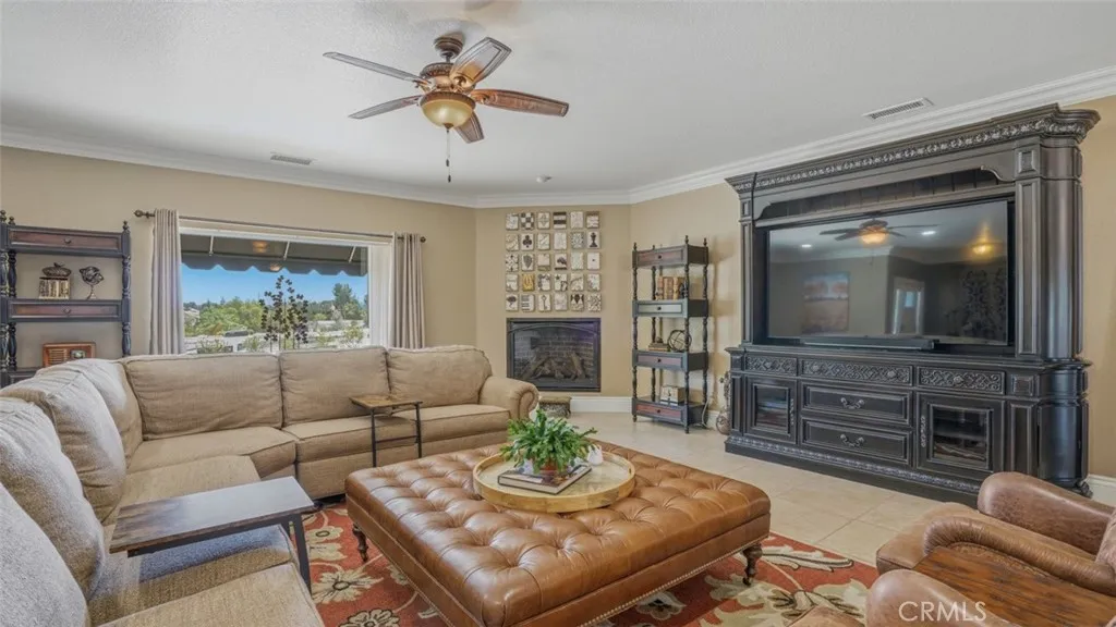 Living Room With Cozy Fireplace and Gorgeous Entertainment Center