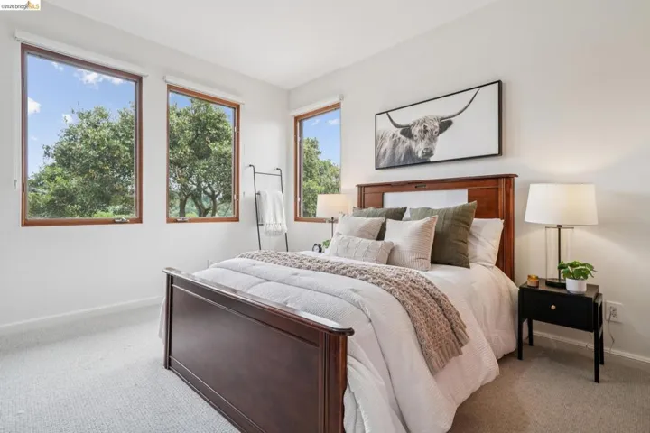 Carpeted bedroom featuring baseboards