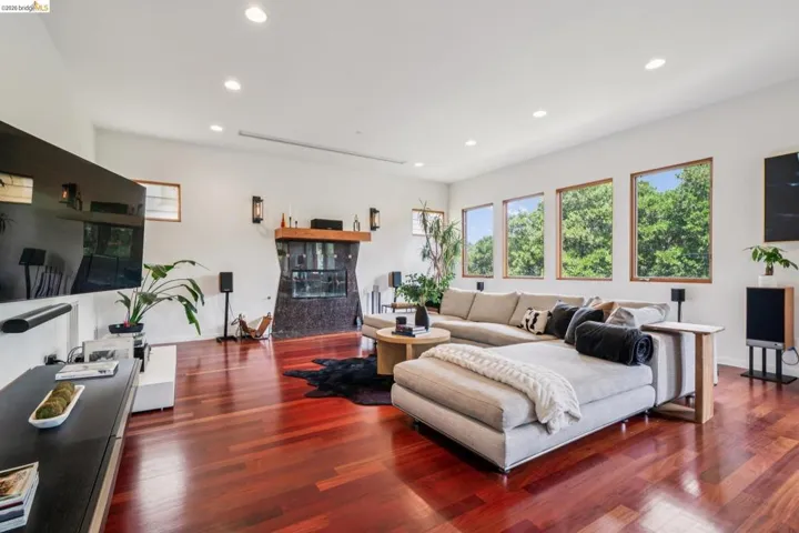 Living room featuring dark wood-style floors and recessed lighting