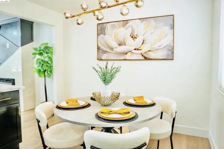 Dining space with light wood-type flooring and baseboards
