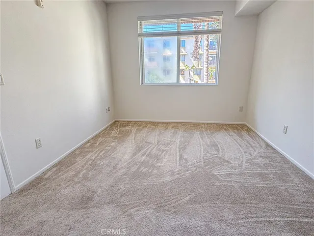 Bedroom with view of courtyard