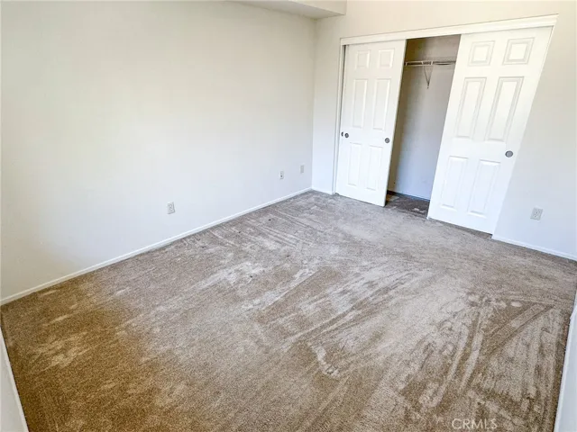 Bedroom with 3-door closet