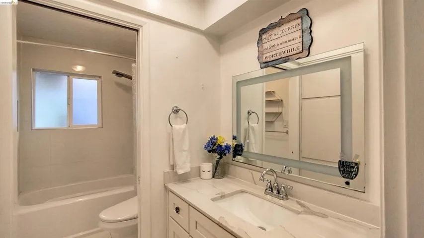 Full bath with vanity and bathtub / shower combination