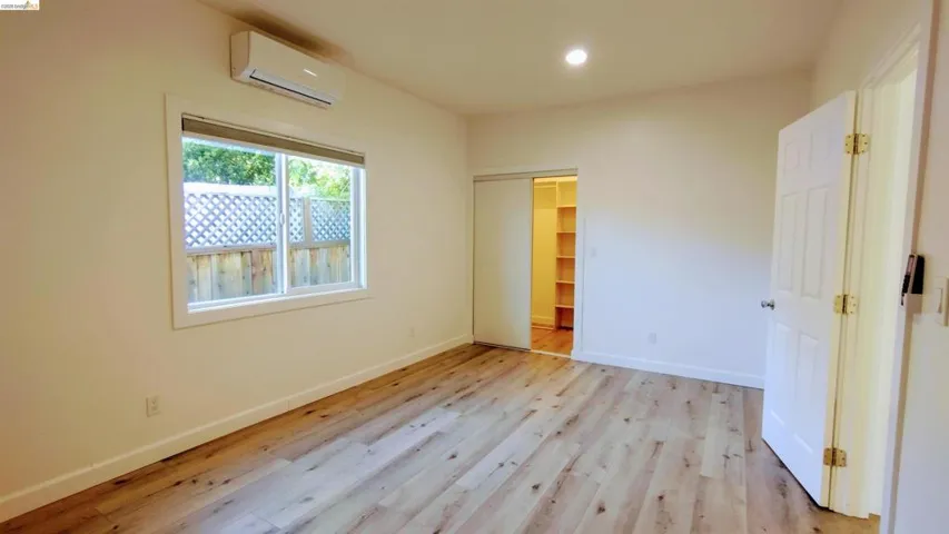 Unfurnished bedroom with light wood-style flooring, a closet, and recessed lighting